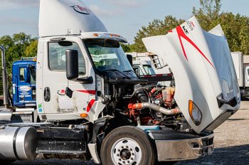 a truck with its hood open exposing its engine
